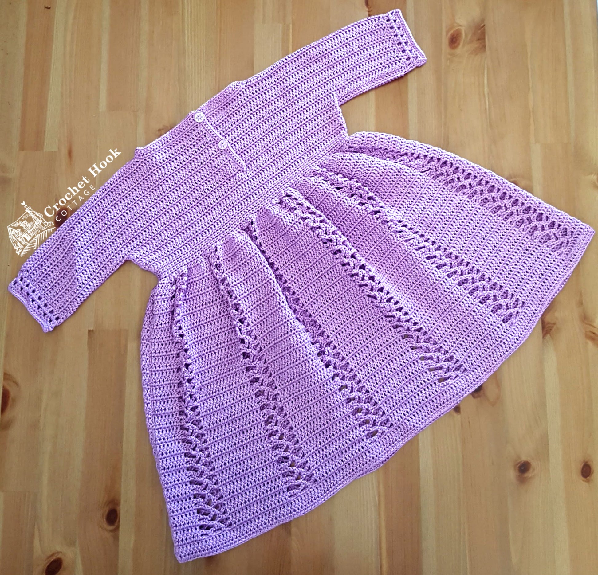 Back view of the Lilac Sally Tolddlers Dress fits ages 12-18 months, three-quarter length sleeves with lacy panels on the skirt - www.crochethookcottage.com