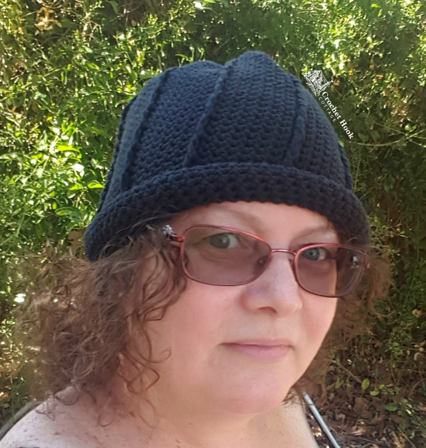 Person wearing black Rolled Brim Slouchy Beanie, 2 styles in 1 convertible beanie, worn with brim rolled up