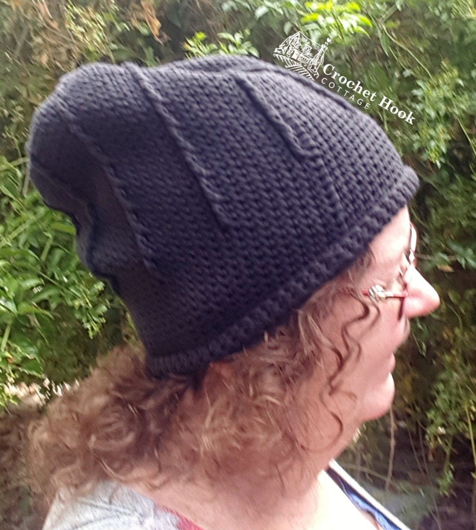 side view of person wearing the black Rolled Brim Slouchy Beanie, 2 styles in 1 convertible beanie, wearing the beanie slouchy style- www.crochethookcottage.com