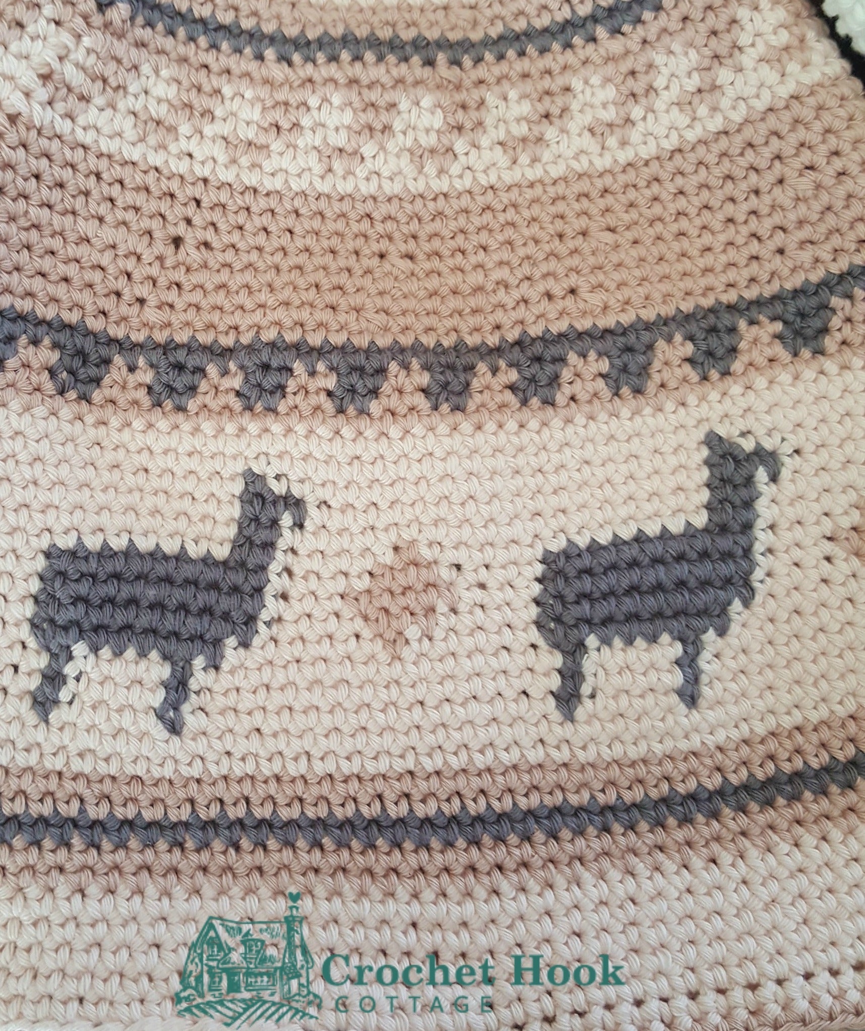 close up of llama motif on the Pink Peruvian Llama Chullo - www.crochethookcottage.com