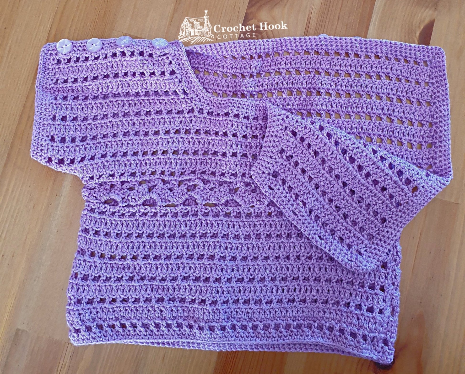 Purple Cuddles Baby Shirt, fits 6 to 12 months old, with buttons on one shoulder unfastened - www.crochethookcottage.com