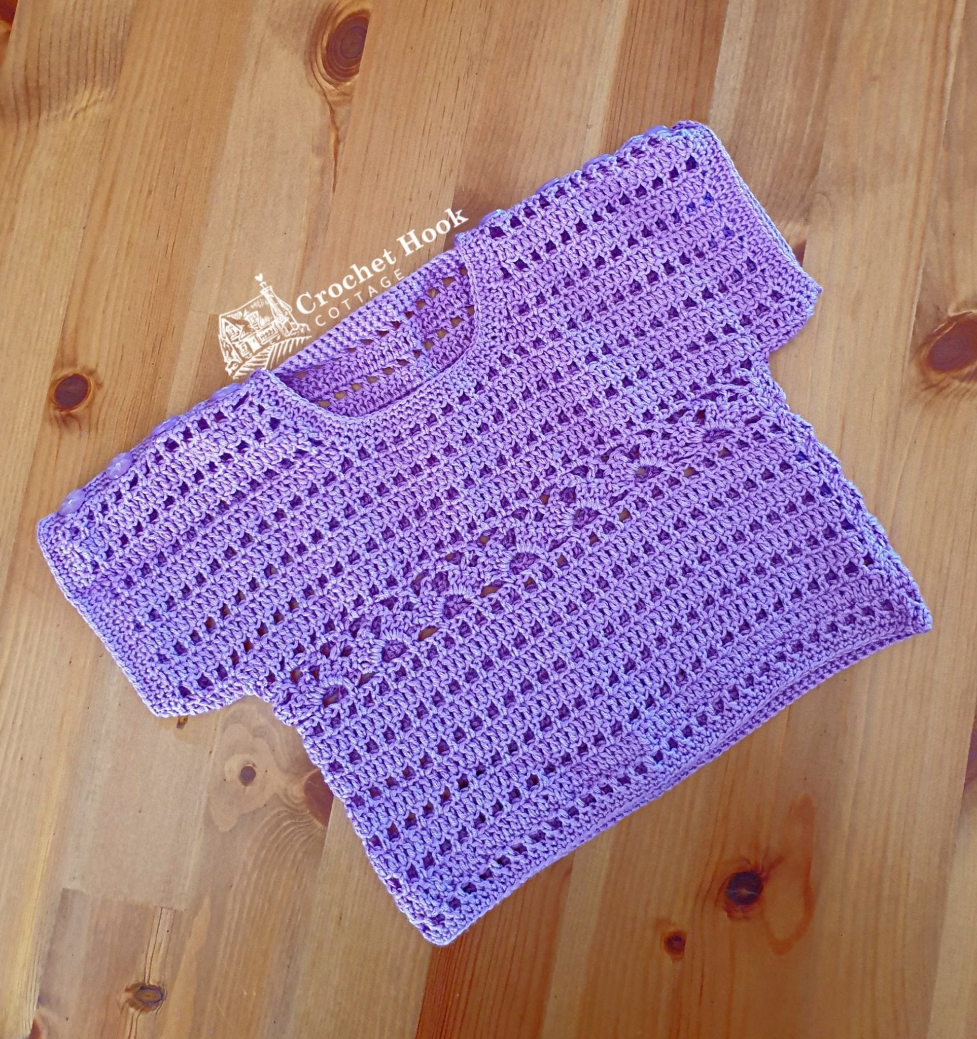 Front view of the Purple Cuddles Baby Shirt, fits babies 6 to 12 months old - www.crochethookcottage.com