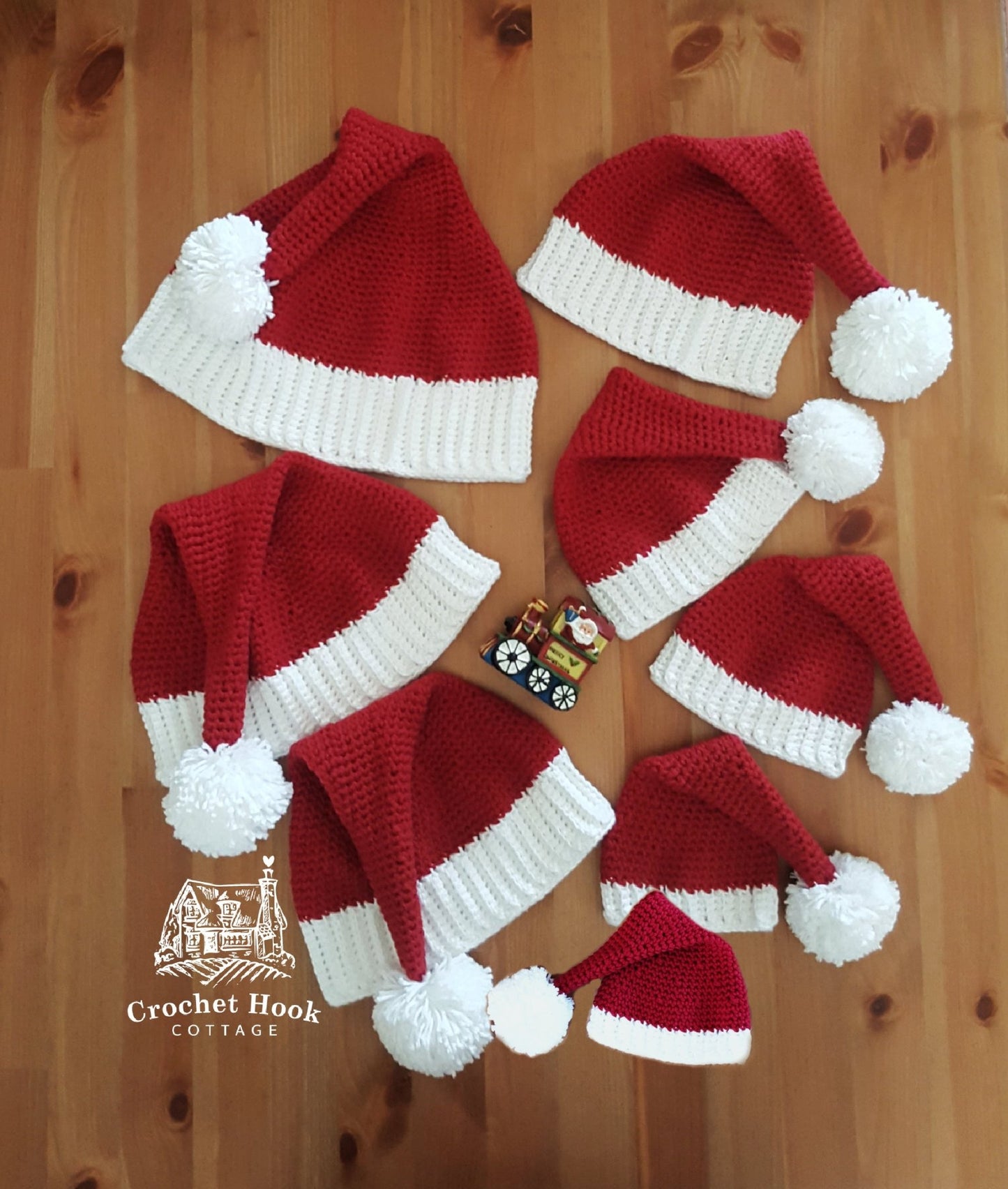 Crocheted red and white Santa Hats in eight sizes, family Christmas Hats, sizes are premature baby, newborn baby, sizes to fit age 0 to 6 months, 6 to 12 months, 1 to 5 years, 5 years to adult small, adult medium and large - www.crochethookcottage.com