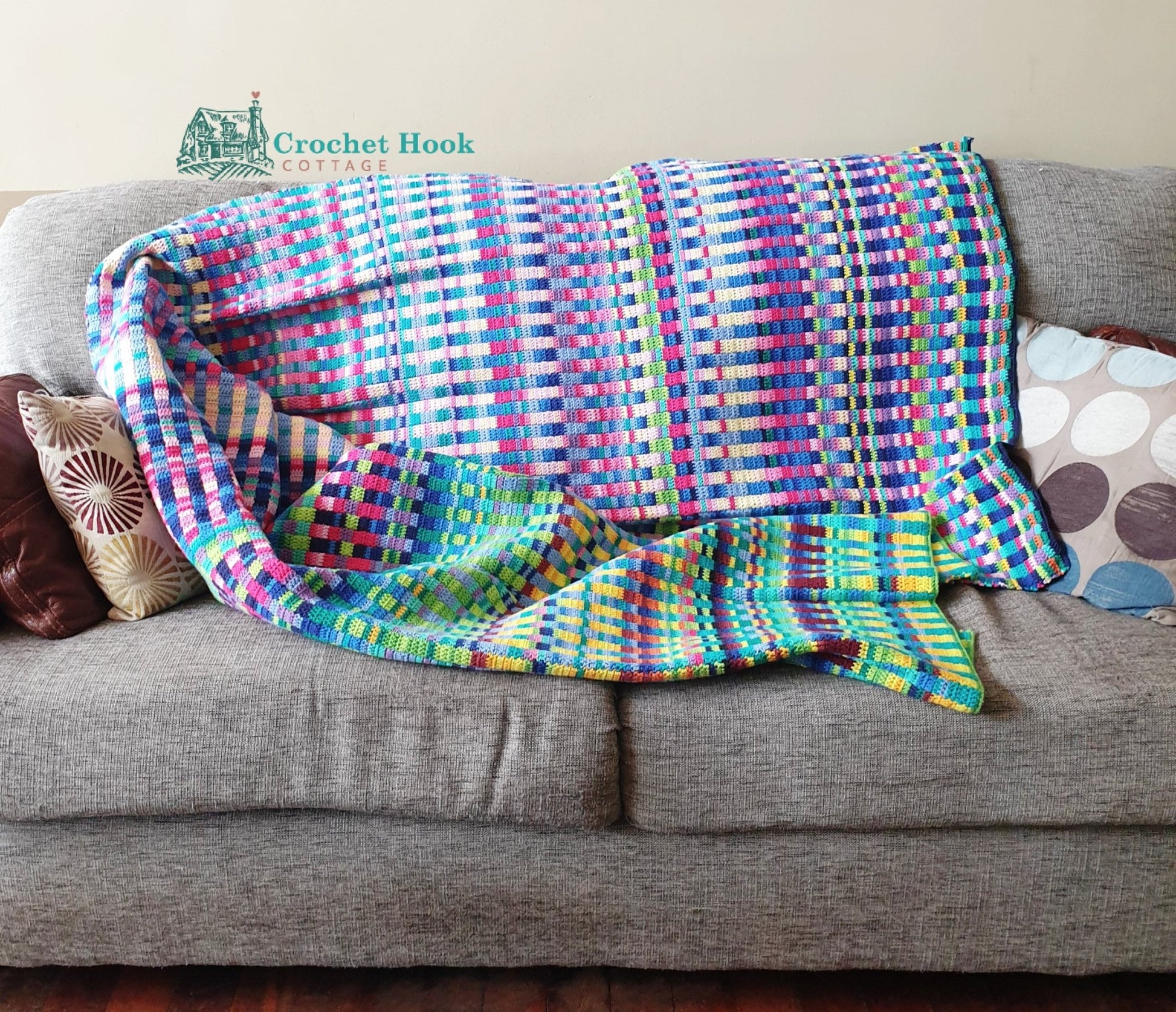 Temperature Blanket Crochet Pattern - Lines and Stripes, US Terminology, colorful blanket on sofa - www.crochethookcottage.com