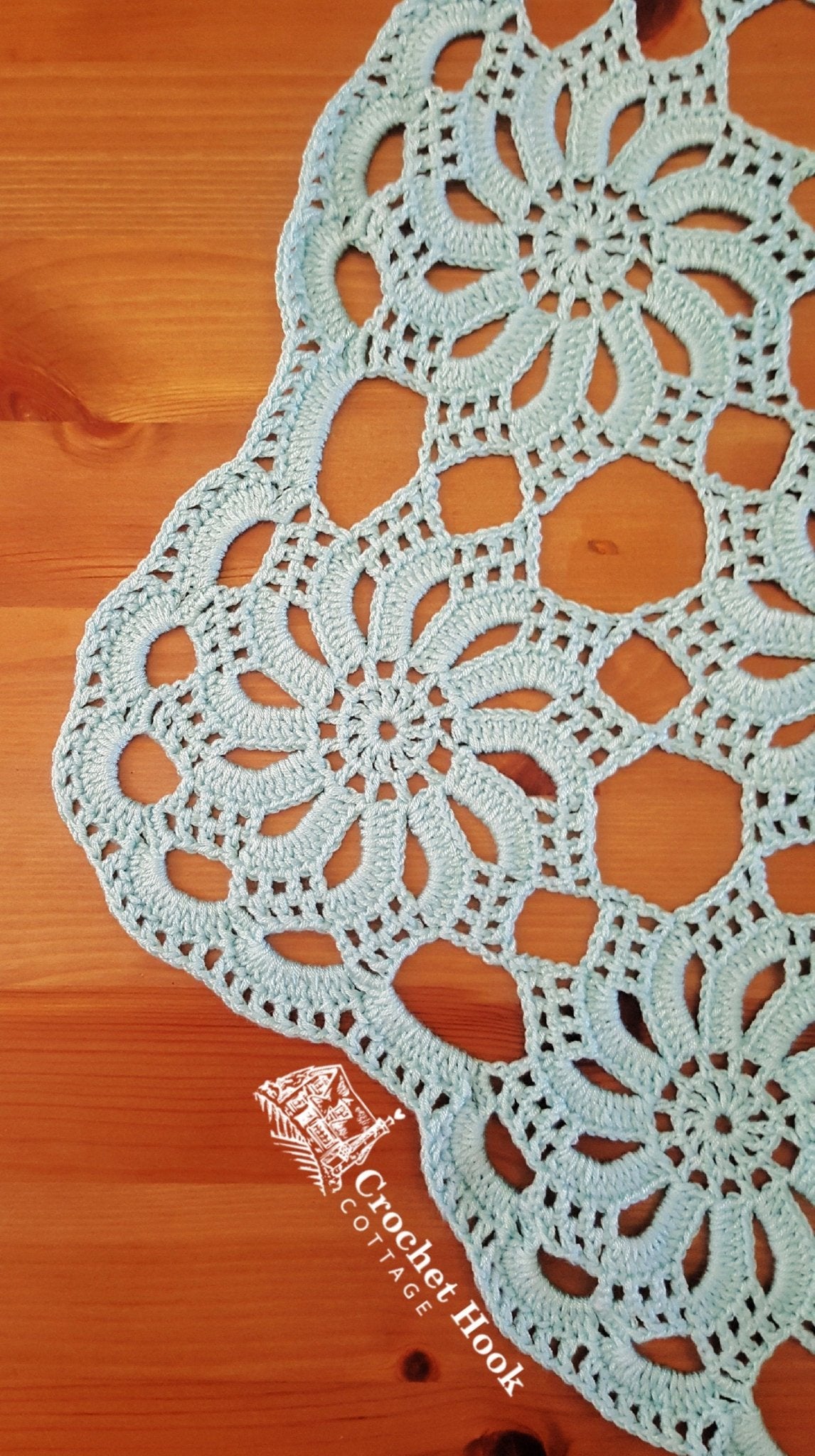 close up of a corner motif from the crocheted lace hexagonal Wheels of Fortune Tablecloth - www.crochethookcottage.com