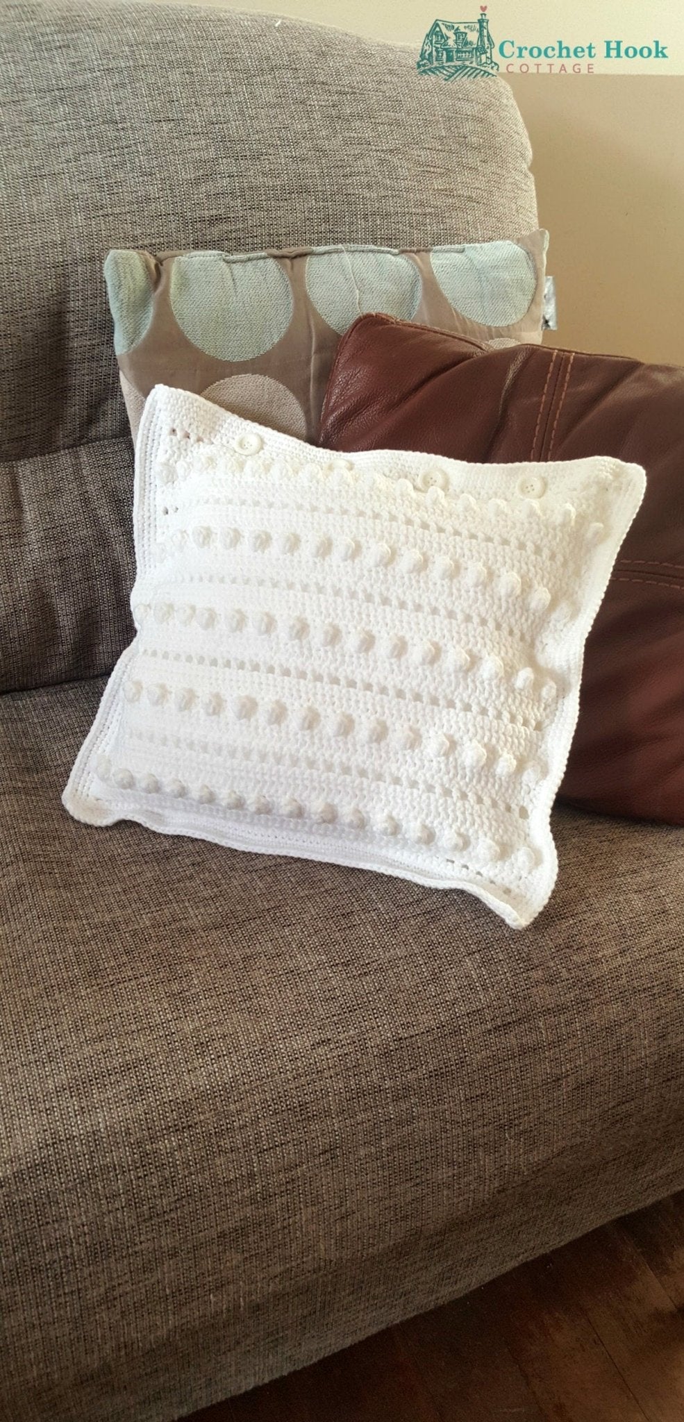 White string of pearls Cushion Cover with cushion insert on a sofa - www.crochethookcottage.com