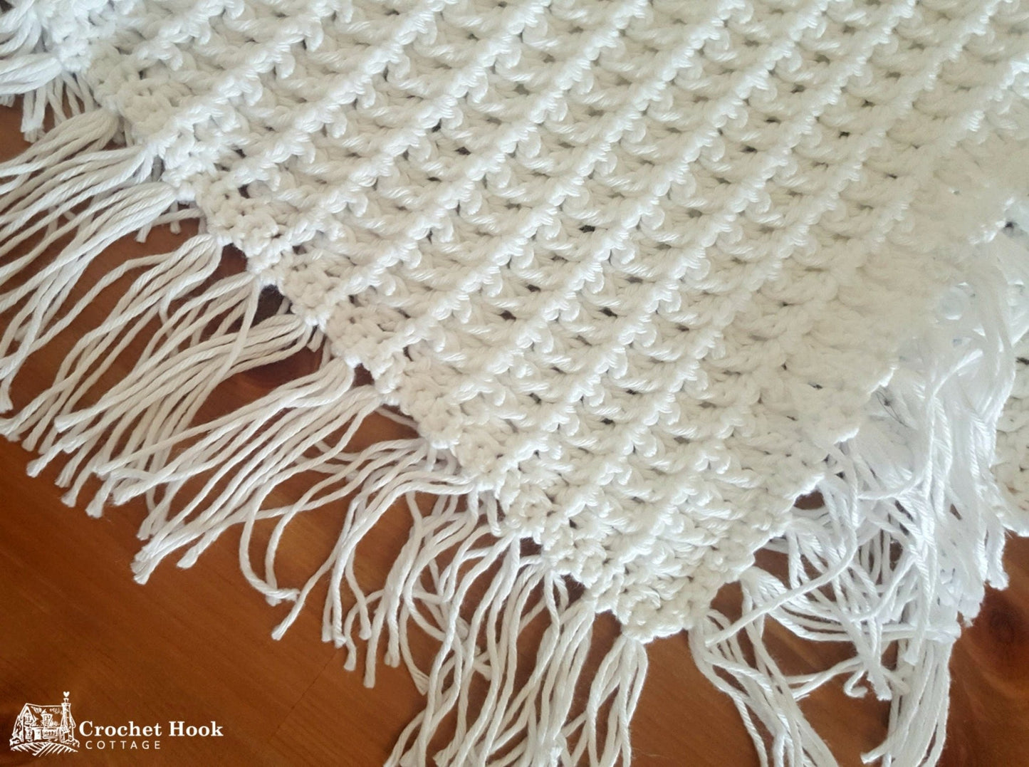 White Fringed Waffle Baby Blanket, close up view of corner and fringing - www.crochethookcottage.com