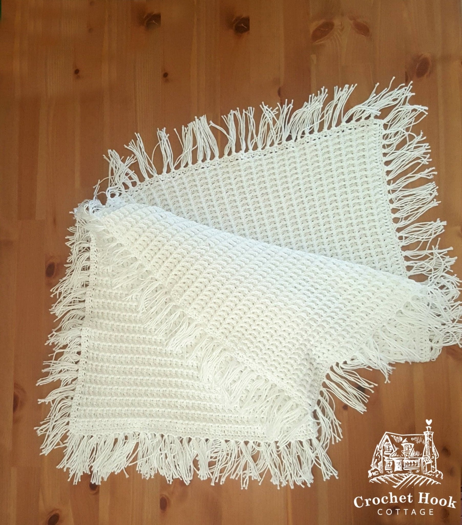 White Fringed Waffle Baby Blanket, folded - www.crochethookcottage.com