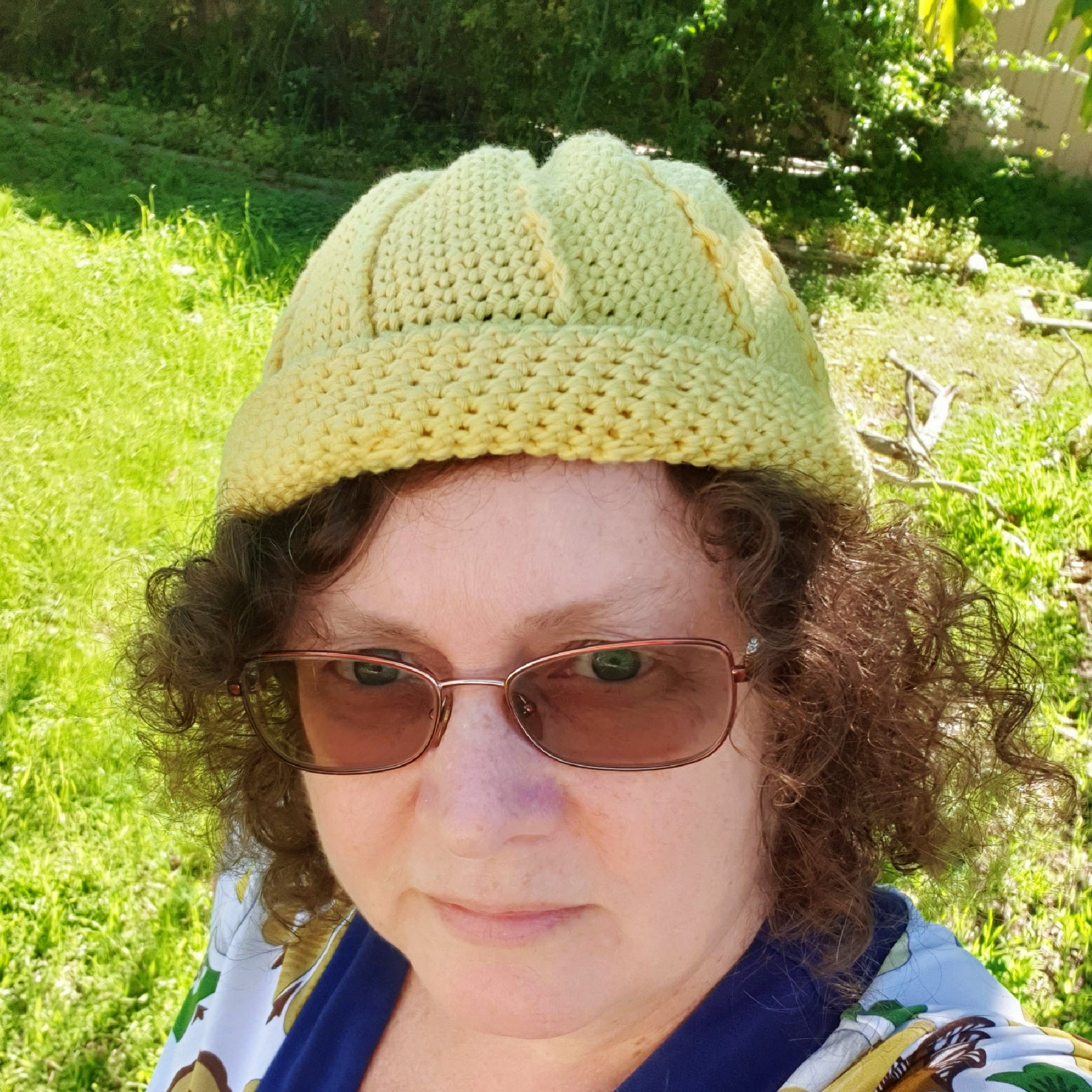 Person wearing Yellow Rolled Brim Slouchy Beanie, 2 styles in 1 convertible beanie, worn with brim rolled up - www.crochethookcottage.com