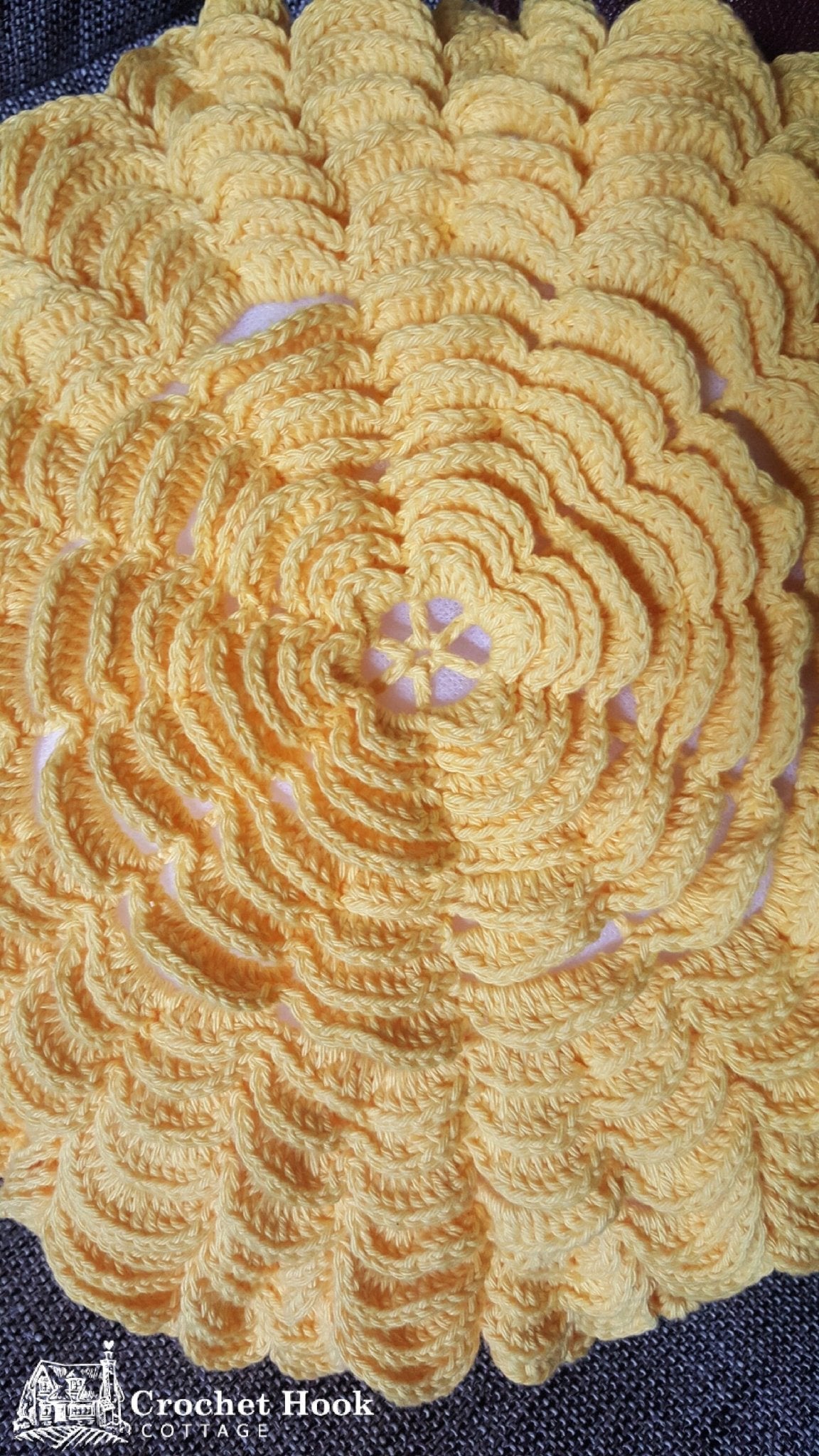 Close-up of crocheted petals on front of the crocheted cotton Yellow Round Petal Cushion Cover - www.crochethookcottage.com